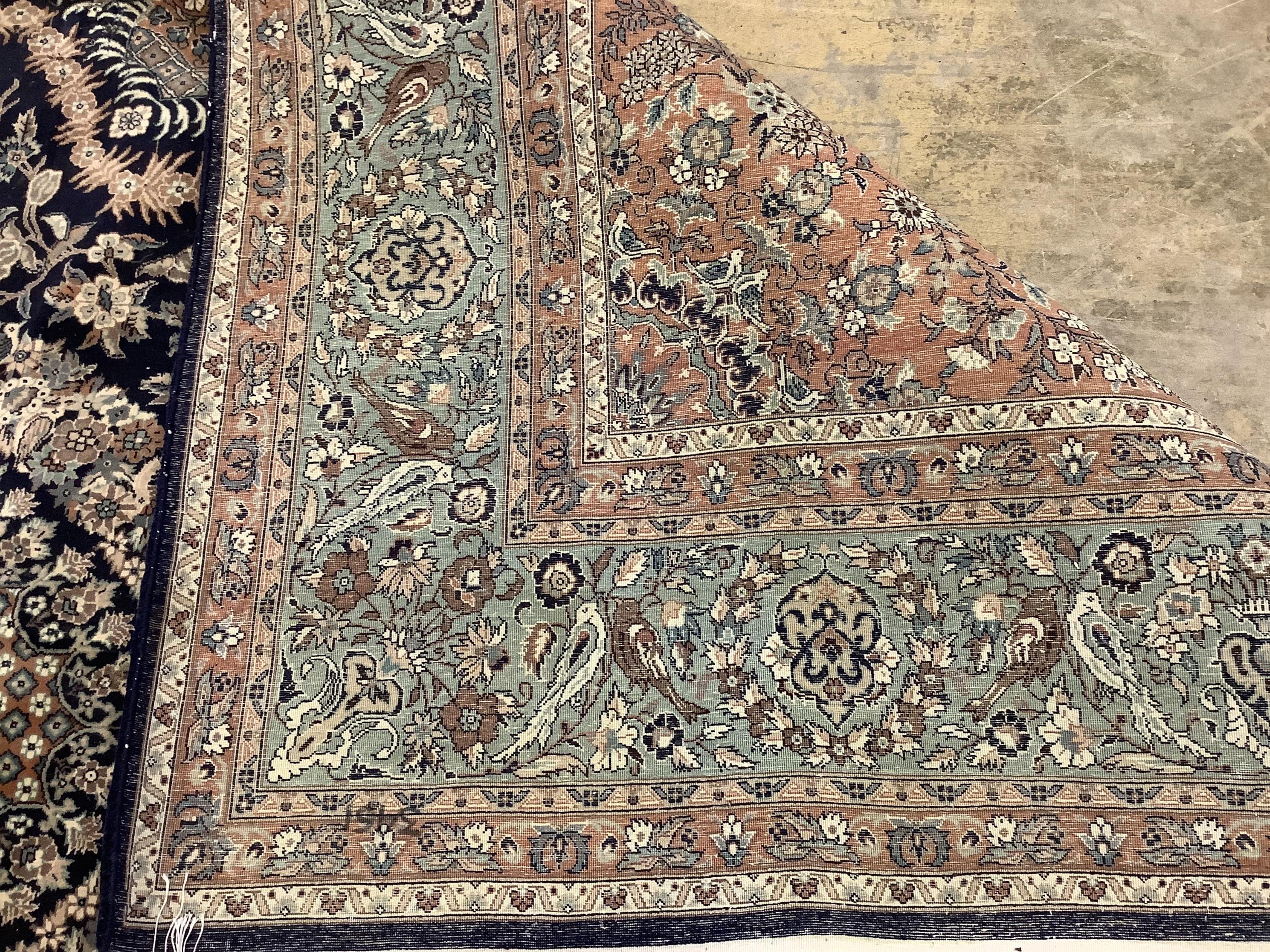 An Isfahan design blue ground rug, 330 x 250cm. Condition - good